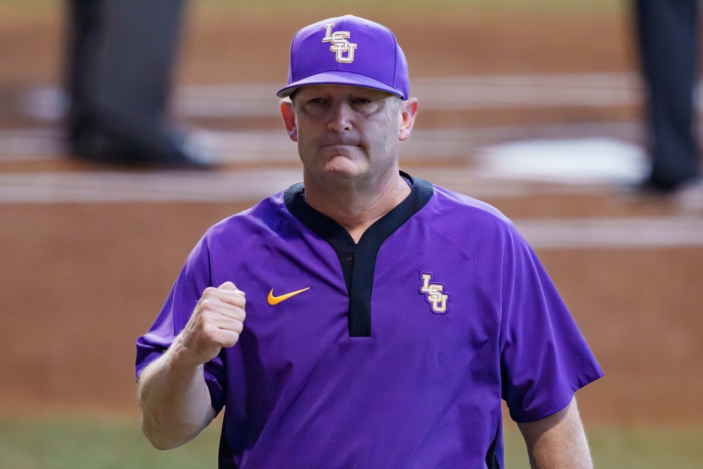 FILE - LSU head baseball coach Jay Johnson fist pumps during an NCAA regional baseball game against Dallas Baptist on May 31, 2025, in Baton Rouge, La. (AP Photo/Matthew Hinton, file)