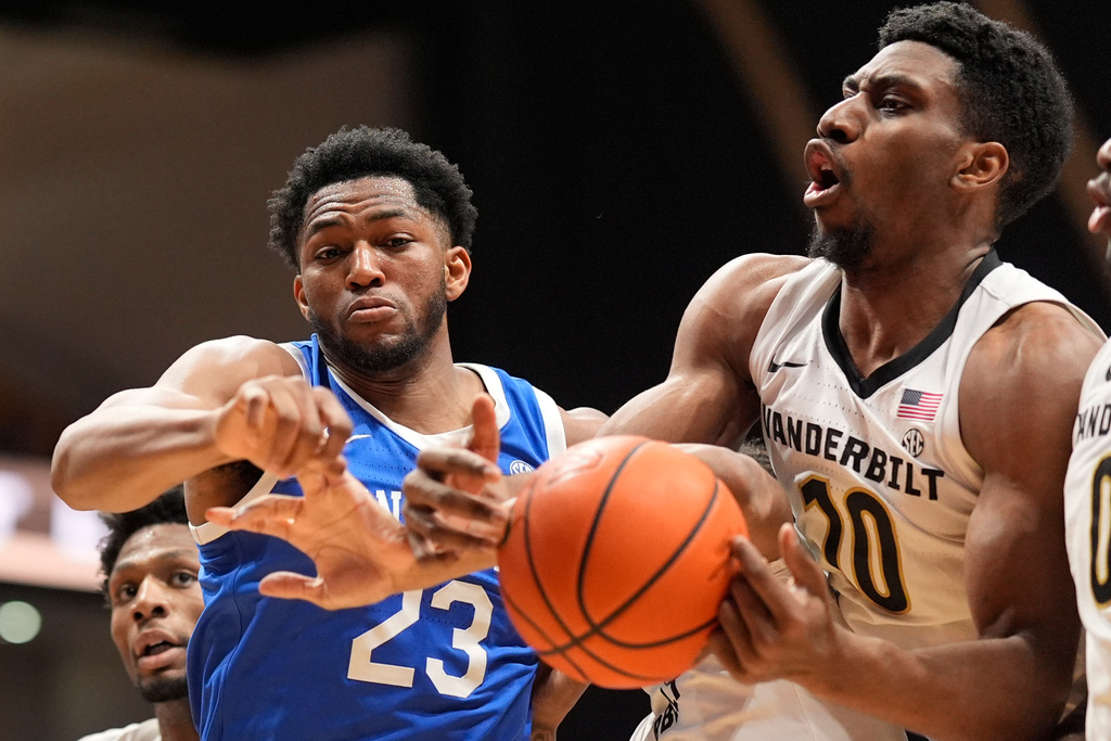 Kentucky forward Mouhamed Dioubate (23) and Vanderbilt forward Ak Okereke (10) battle for a rebound during the first half of an NCAA college basketball game Tuesday, Jan. 27, 2026, in Nashville, Tenn. (AP Photo/George Walker IV)