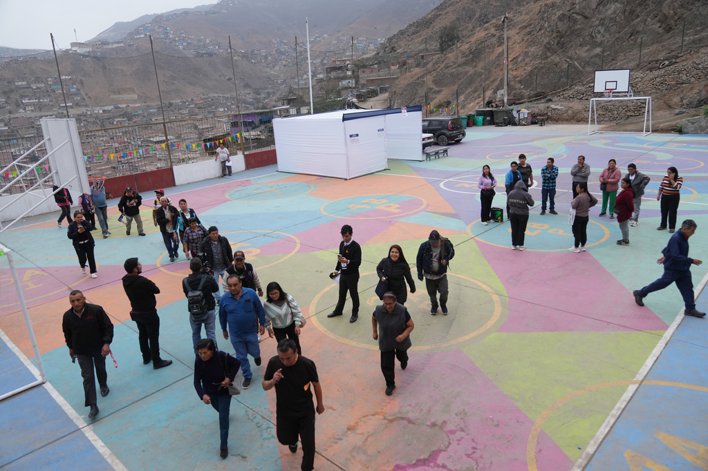 Voters arrive at a polling station during the presidential runoff election in Lima, Peru, Sunday, June 7, 2026. (AP Photo/Rodrigo Abd)