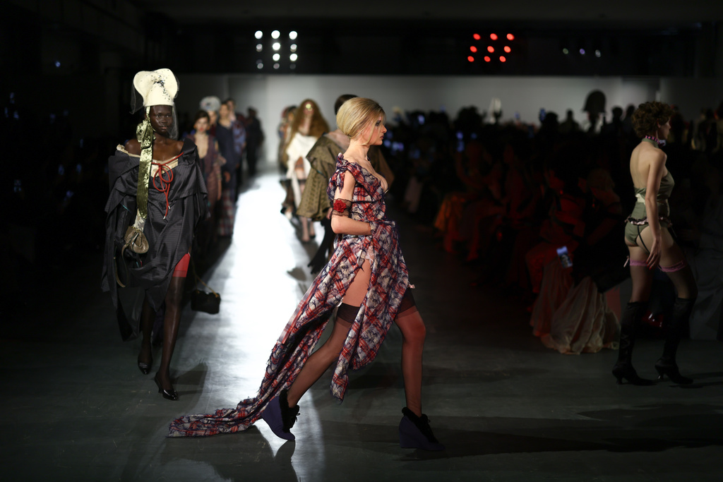 Models wear creations from the Vivienne Westwood Fall/Winter 2026-2027 Women's collection presented in Paris, Saturday, March 7, 2026. (AP Photo/Tom Nicholson)