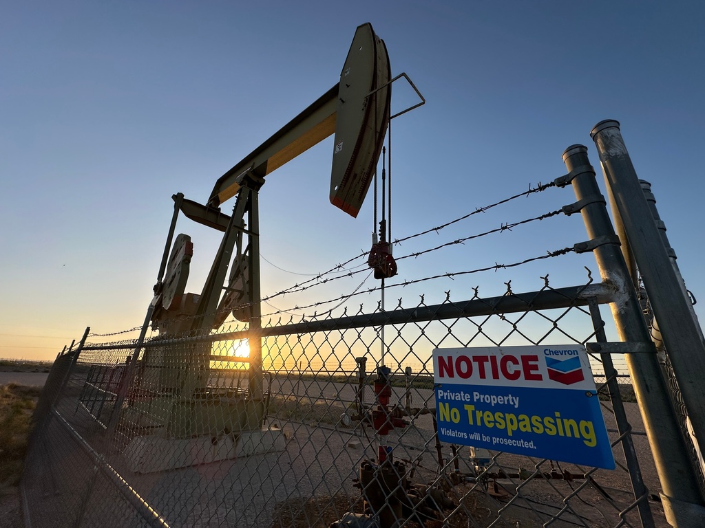 The sun sets behind an oil pump jack near Loving, N.M., on Tuesday, May 20, 2025. (AP Photo/Susan Montoya Bryan)