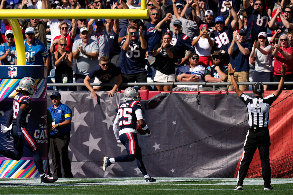 New England Patriots cornerback Marcus Jones (25) returns a punt for a touchdown against the Carolina Panthers during the first half of an NFL football game, Sunday, Sept. 28, 2025, in Foxborough, Mass. (AP Photo/Charles Krupa)