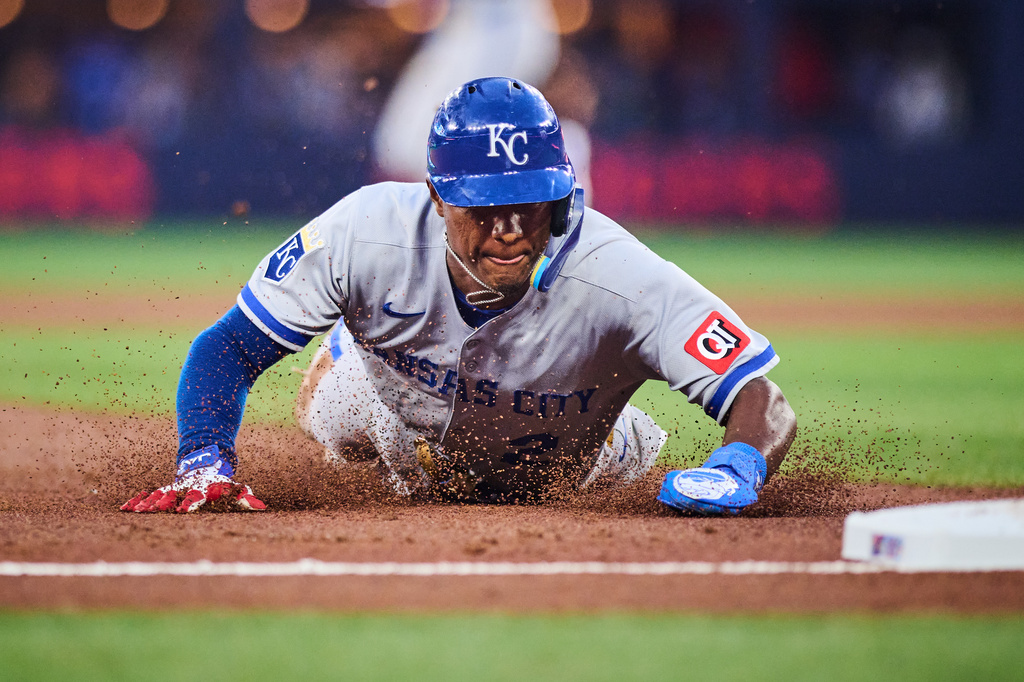 Kansas City Royals' Tyler Tolbert (2) slides in to steal third base during third inning of a baseball game against the Toronto Blue Jays in Toronto, Wednesday, Aug. 26, 2026. (Sammy Kogan/The Canadian Press via AP)