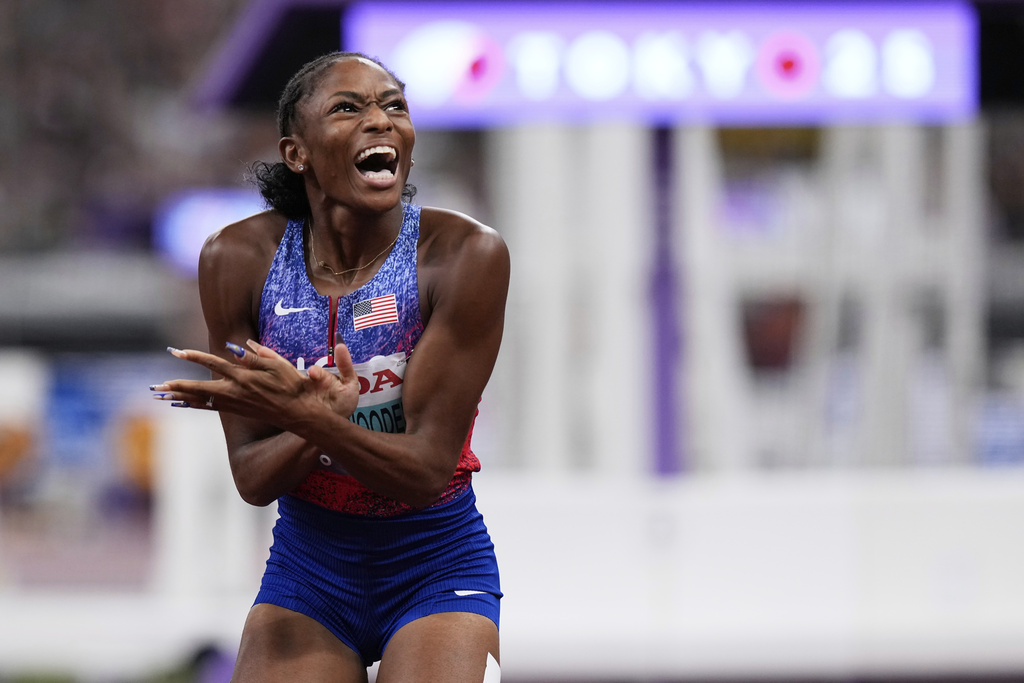 United States' Melissa Jefferson-Wooden reacts after winning the women's 100 meters final at the World Athletics Championships in Tokyo, Sunday, Sept. 14, 2025. (AP Photo/Eugene Hoshiko)