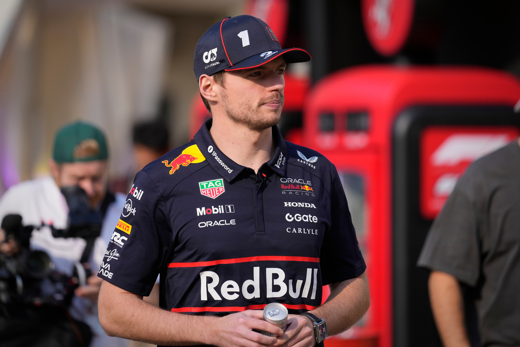 Red Bull driver Max Verstappen of the Netherlands walks through the paddock at the Yas Marina Circuit ahead of the Abu Dhabi Grand Prix in Abu Dhabi, United Arab Emirates, Thursday, Dec. 4, 2025. (AP Photo/Darko Bandic)