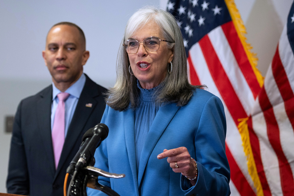 House Minority Leader Hakeem Jeffries, D-N.Y., left, looks on as House Democratic Whip Katherine Clark, D-Mass., speaks about Virginia's redistricting vote, at the Democratic National Committee headquarters in Washington, Wednesday, April 22, 2026. Virginia voters approved a congressional redistricting plan that could help Democrats win up to four additional U.S. House seats in this year's midterm elections. (AP Photo/Cliff Owen)