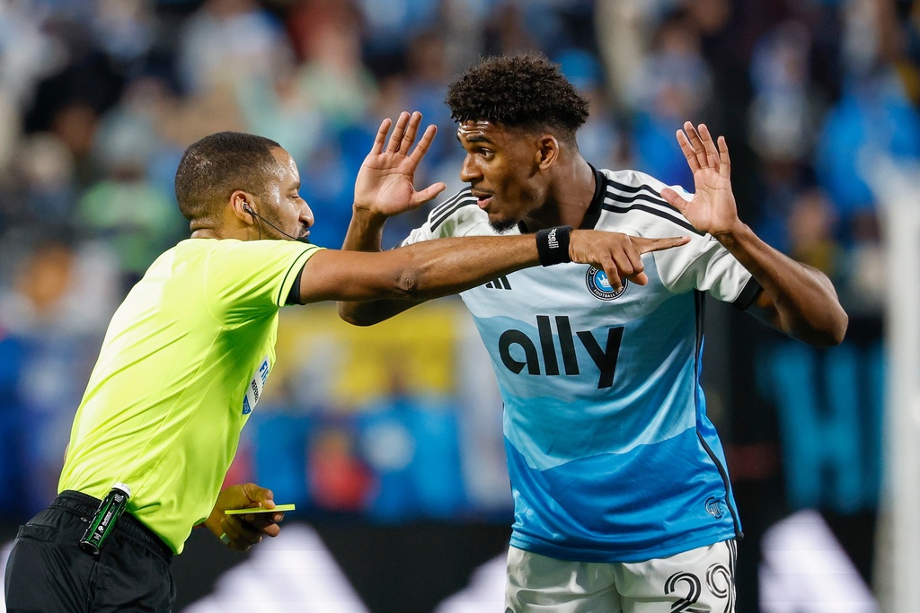 Charlotte FC defender Adilson Malanda argues with referee Jon Freeman during the second half against New York City FC in Game 1 of the first round of MLS soccer's Eastern Conference playoffs in Charlotte, N.C., Tuesday, Oct. 28, 2025. (AP Photo/Nell Redmond)