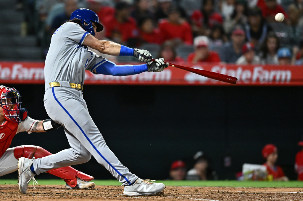 Kansas City Royals' Jac Caglianone hits a two-run home run during the fifth inning of a baseball game against the Los Angeles Angels, Friday, Aug. 14, 2026, in Anaheim, Calif. (AP Photo/William Liang)