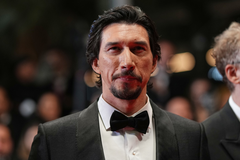 FILE - Adam Driver poses for photographers upon arrival at the premiere of the film 'Paper Tiger' at the 79th international film festival, Cannes, southern France, Saturday, May 16, 2026. (Photo by Scott A Garfitt/Invision/AP, File)