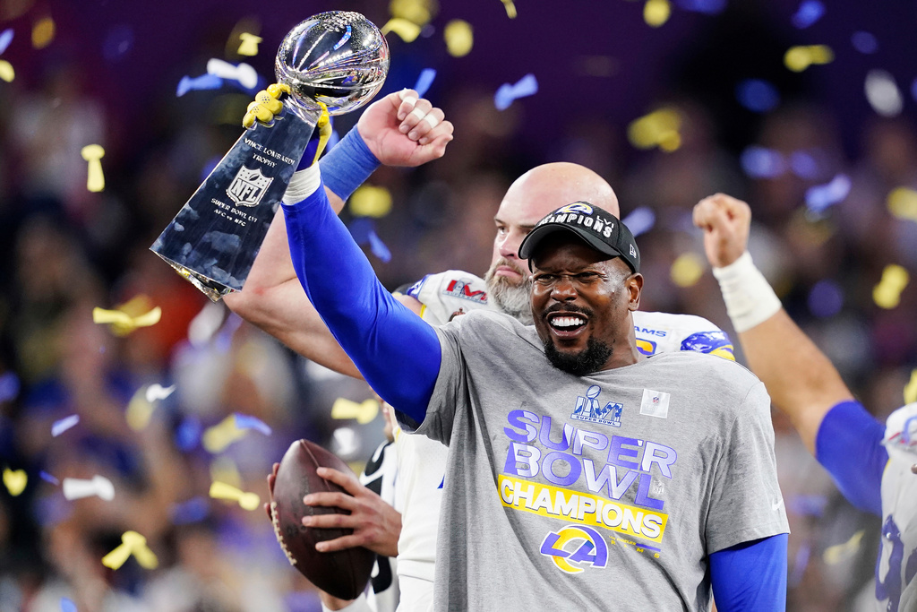 FILE - Los Angeles Rams outside linebacker Von Miller (40) holds up the Vince Lombardi trophy after defeating the Cincinnati Bengals at the NFL Super Bowl 56 football game Sunday, Feb. 13, 2022, in Inglewood, Calif. (AP Photo/Steve Luciano, File)