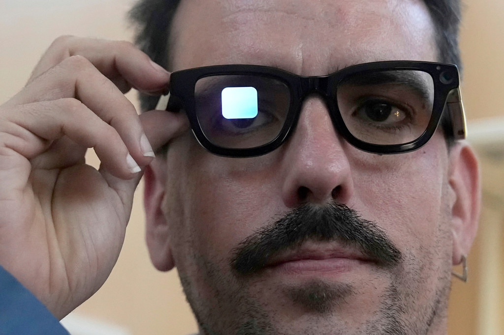 FILE - Michael Mcloughlin, of El Confidencial, gets a demonstration of Gemini on Android XR glasses at a Google I/O event in Mountain View, Calif., Tuesday, May 20, 2025. (AP Photo/Jeff Chiu, File)