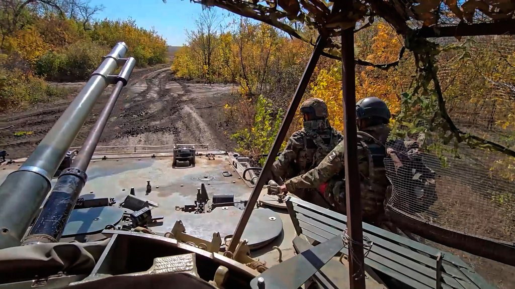 In this image made from video provided by the Russian Defense Ministry Press Service on Friday, Oct. 31, 2025, Russian servicemen attend a practice for sabotage operations behind enemy lines at a training ground on an undisclosed location. (Russian Defense Ministry Press Service via AP)