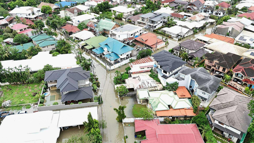 Residential areas are flooded by Typhoon Kalmaegi as it affects Cebu city, central Philippines, Tuesday, Nov. 4, 2025. (AP Photo/Jacqueline Hernandez)