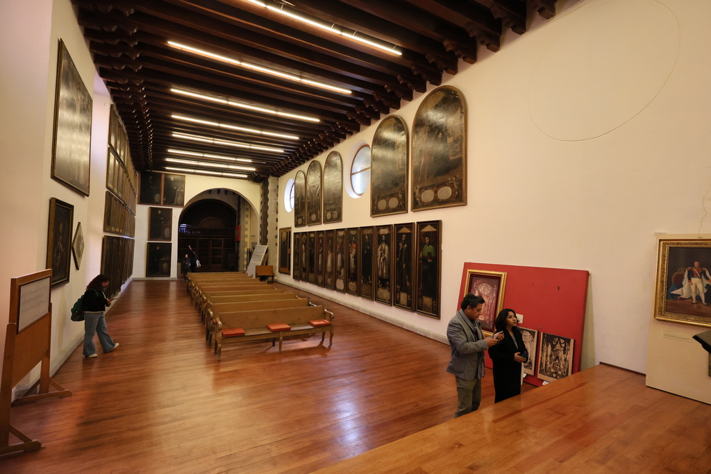 People look at the restored art gallery at La Profesa church in Mexico City, Tuesday, Jan. 27, 2026. (AP Photo/Ginnette Riquelme)