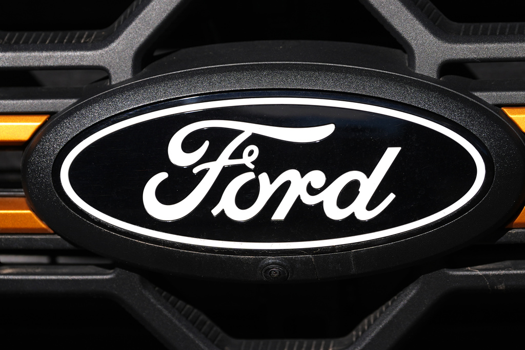 FILE - The company logo is shown on the grille of an unsold 2026 F-series pickup truck on the lot of a Ford dealership Sunday, Nov. 2, 2025, in Littleton, Colo. (AP Photo/David Zalubowski, file)