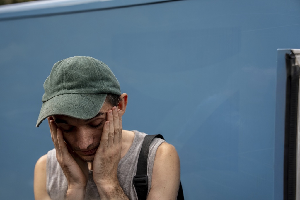Dmytro Trush, who lost his mother, reacts, while he is being evacuated from the village of Yarova, that was hit by Russian aerial strike, which killed dozens of civilians, in Sloviansk, Donetsk region, Tuesday, Sept.9, 2025. (AP Photo/Alex Babenko)