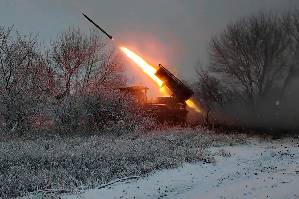 In this image, made from video provided by Russian Defense Ministry Press Service on Tuesday, Dec. 16, 2025, a Russian "Grad" self-propelled multiple rocket launcher fires towards Ukrainian positions on an undisclosed location in Ukraine. (Russian Defense Ministry Press Service via AP)