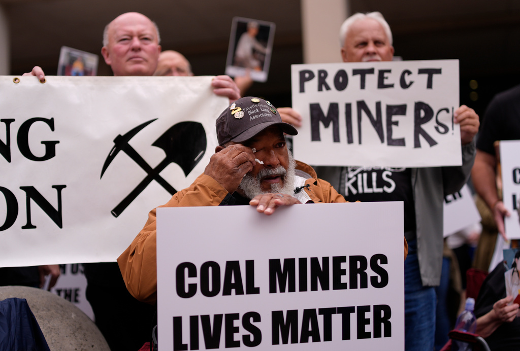 Gary Hairston, president of the Fayette County Black Lung Association and the National Black Lung Association, wipes tears from his eyes during a protest outside the U.S. Department of Labor, Oct. 14, 2025, in Washington. (AP Photo/Carolyn Kaster)