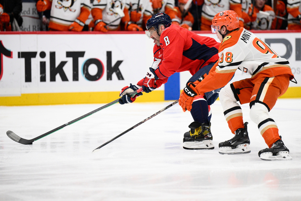 Washington Capitals left wing Alex Ovechkin (8) skates with the puck against Anaheim Ducks defenseman Pavel Mintyukov (98) during the first period of an NHL hockey game, Monday, Jan. 5, 2026, in Washington. (AP Photo/Nick Wass)