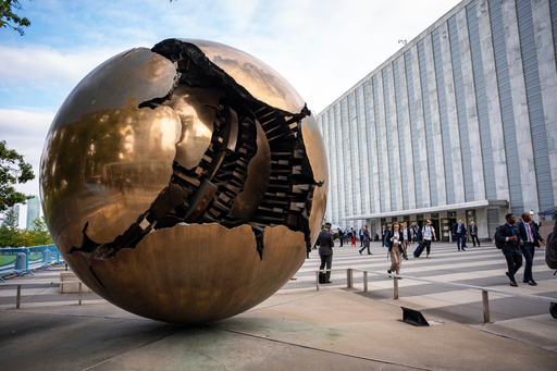 FILE - People walk around the plaza by the Sphere Within Sphere outside the United Nations Headquarters on the first day of the 80th session of the UN General Assembly's High-Level week, Monday, Sept. 22, 2025. (AP Photo/Angelina Katsanis, File) FILE - People walk around the plaza by the Sphere Within Sphere outside the United Nations Headquarters on the first day of the 80th session of the UN General Assembly's High-Level week, Monday, Sept. 22, 2025. (AP Photo/Angelina Katsanis, File)