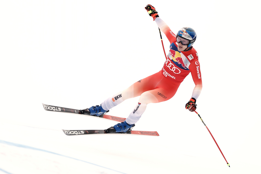 Switzerland's Marco Odermatt speeds down the course during a men's alpine ski World Cup downhill, in Kitzbuehel, Austria, Saturday, Jan. 24, 2026. (AP Photo/Gabriele Facciotti)