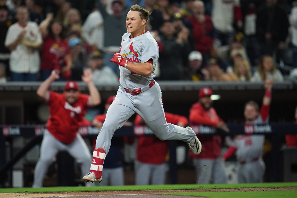 St. Louis Cardinals' JJ Wetherholt rounds third base, on his way to scoring after hitting a bases-loaded RBI single combined with a fielding error by San Diego Padres right fielder Fernando Tatis Jr. during the fifth inning of a baseball game Friday, May 8, 2026, in San Diego. Four runs scored on the play. (AP Photo/Gregory Bull)