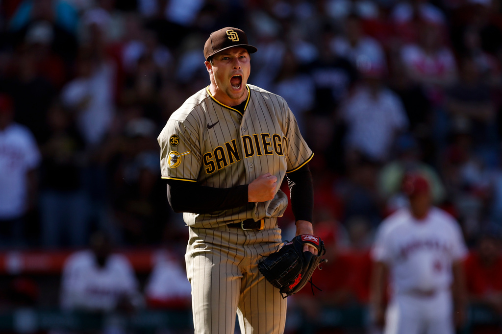 San Diego Padres relief pitcher Mason Miller (22) reacts upon striking out the last batter to defeat the Los Angeles Angels at the end of the ninth inning of a baseball game, Sunday, April 19, 2026, in Anaheim, Calif. (AP Photo/Caroline Brehman)