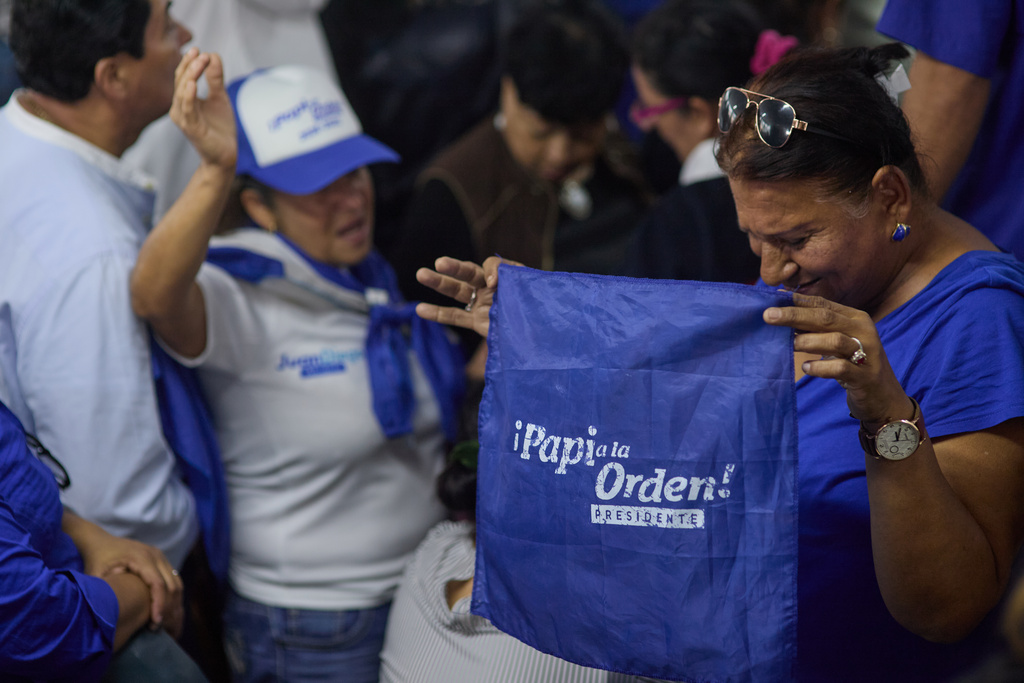 Supporters of the National Party celebrate after the National Electoral Council declared presidential candidate Nasry Asfura the winner of Honduras' presidential election in Tegucigalpa, Honduras, Wednesday, Dec. 24, 2025. (AP Photo/Fernando Destephen)
