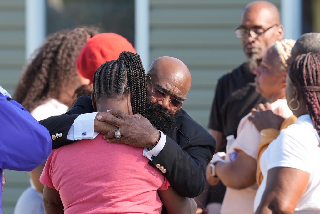 Councilman Reverend James Green consoles people outside the scene of a mass shooting, Sunday, April 19, 2026, in Shreveport, La. (AP Photo/Gerald Herbert)