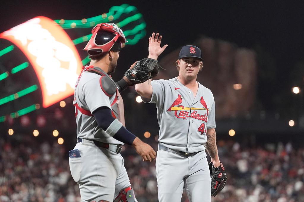 St. Louis Cardinals catcher Leo Bernal, left, celebrates with pitcher Gordon Graceffo after San Francisco Giants' Jung Hoo Lee flew out to end the seventh inning of a baseball game, Tuesday, Sept. 8, 2026, in San Francisco. (AP Photo/Jeff Chiu)