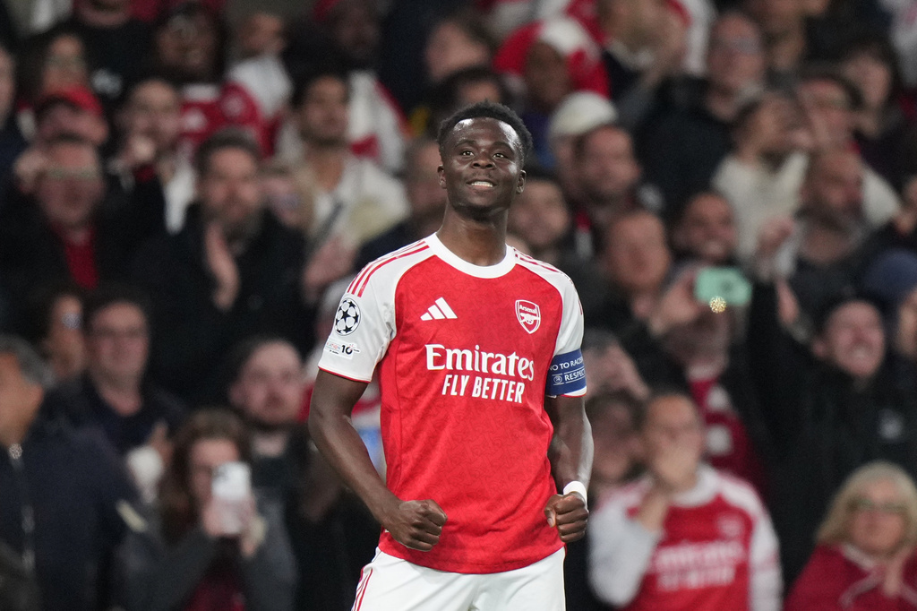 Arsenal's Bukayo Saka celebrates after scoring the opening goal during a Champions League semifinal, second leg, soccer match between Arsenal FC and Atletico Madrid in London, Tuesday, May 5, 2026. (AP Photo/Alastair Grant)