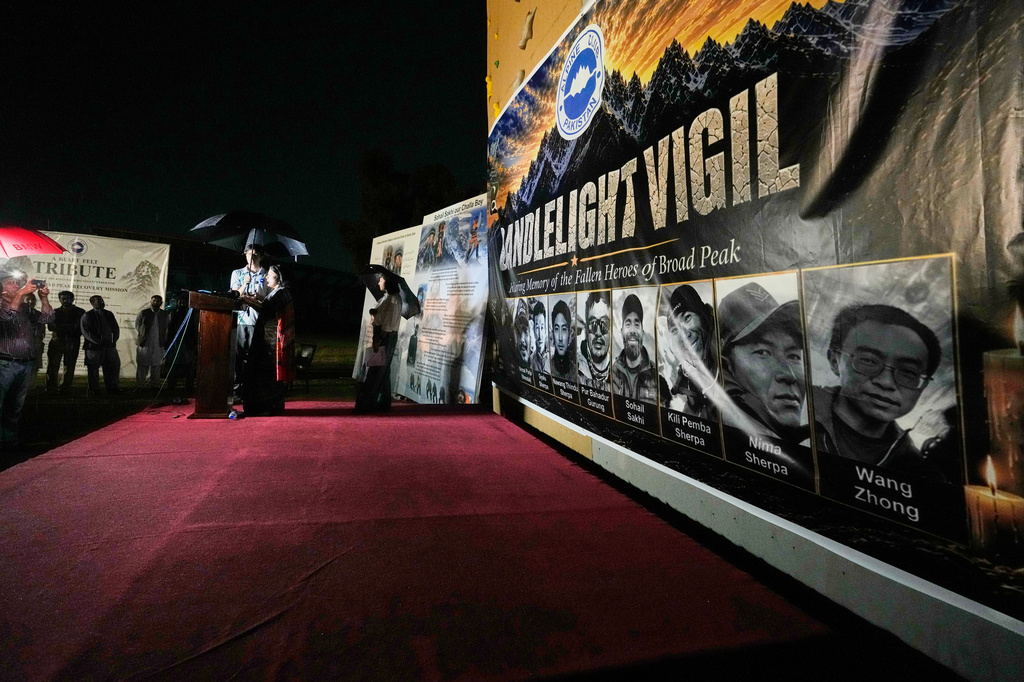 Nepalese Ambassador to Pakistan Rita Dhital, center, delivers her speech during a candlelight vigil in memory of 10 climbers who lost their lives on Broad Peak, in Islamabad, Pakistan, Tuesday, Aug. 11, 2026. (AP Photo/Anjum Naveed)