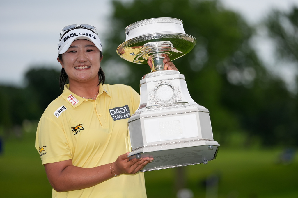 Haeran Ryu, of South Korea, poses with the trophy after winning the Women's PGA Championship golf tournament at Hazeltine National Golf Club, Sunday, June 28, 2026, in Chaska, Minn. (AP Photo/Chris Carlson)