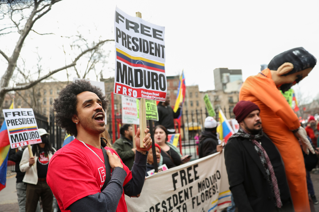 Demonstrators protest outside Manhattan federal court before a pre-trial hearing in former Venezuela President Nicolas Maduro's drug trafficking case, Thursday, March 26, 2026, in New York. (AP Photo/Heather Khalifa)