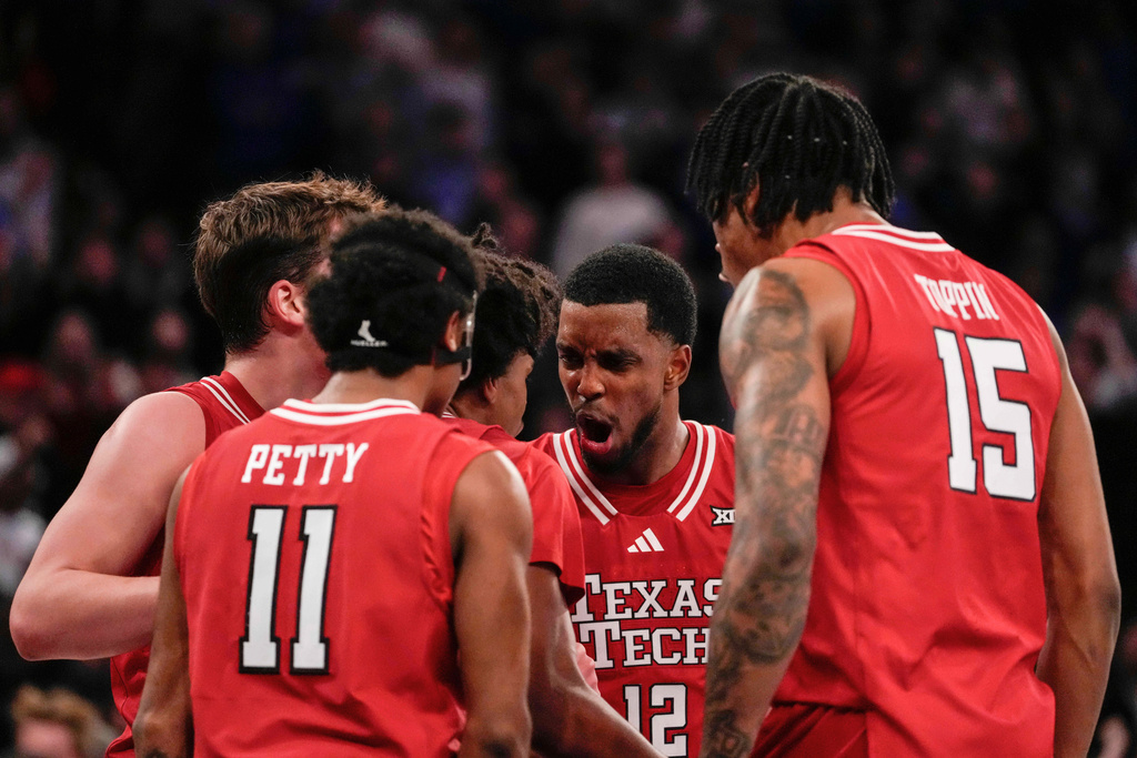 Texas Tech forward Donovan Atwell (12) celebrates Texas Tech guard Christian Anderson during the second half of an NCAA college basketball game against Duke, Saturday, Dec. 20, 2025, in New York. (AP Photo/Yuki Iwamura)