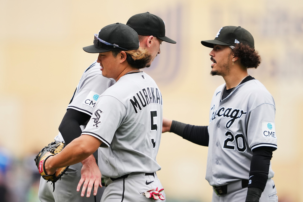 Chicago White Sox pitcher Bryan Hudson, left, first baseman Munetaka Murakami (5) and third baseman Miguel Vargas (20) celebrate after winning a baseball game against the Minnesota Twins, Saturday, Aug. 29, 2026, in Minneapolis. (AP Photo/Ellen Schmidt)