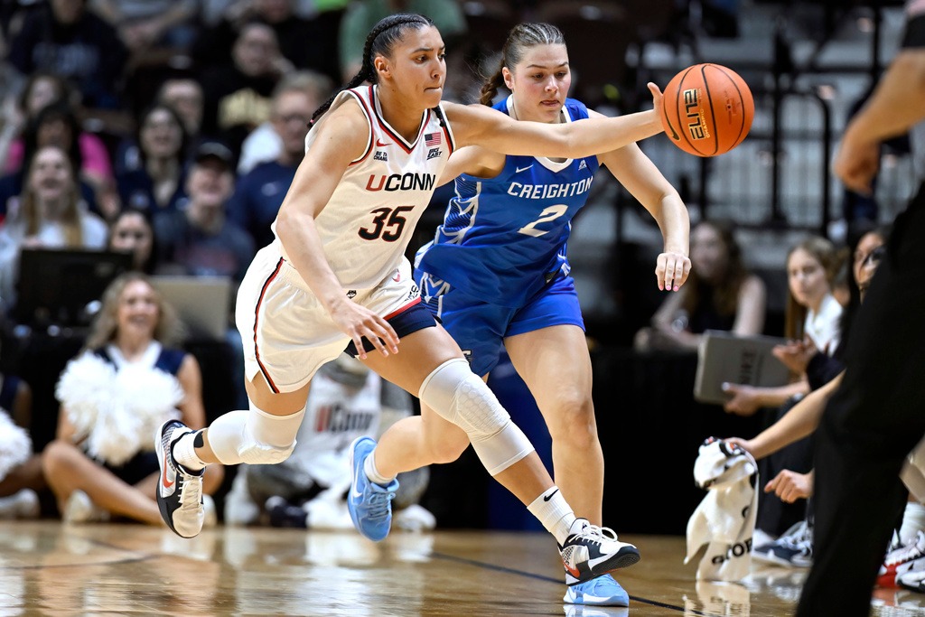 UConn guard Azzi Fudd (35) steals the ball from Creighton guard Kennedy Townsend (2) during first half of an NCAA college basketball game in the semifinals of the Big East tournament, Sunday, March 8, 2026, in Uncasville, Conn. (AP Photo/Jessica Hill)