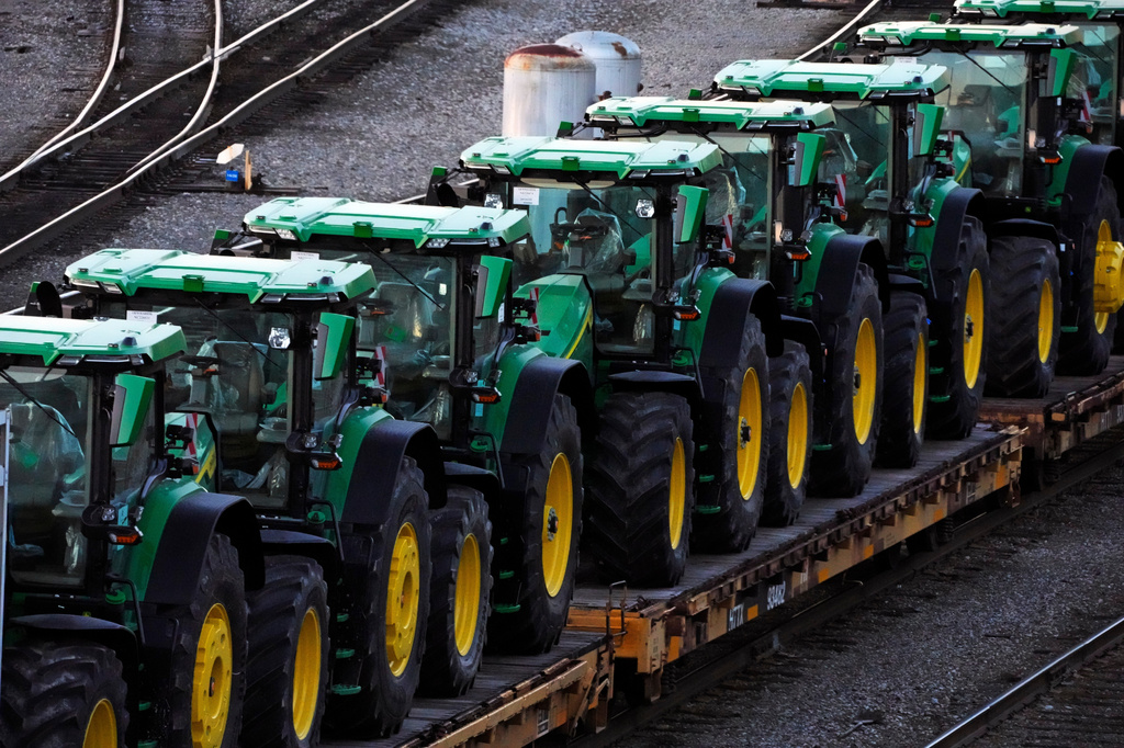 FILE - John Deere tractors sit in Norfolk Southern's Conway Yard in Conway, Pa., Dec. 5, 2022. (AP Photo/Gene J. Puskar, File)