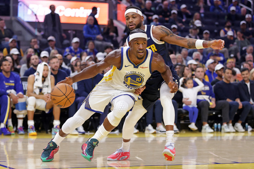 Golden State Warriors' Jimmy Butler III (10) drives past Denver Nuggets' Bruce Brown during the first half of an NBA basketball game in San Francisco on Thursday, Oct. 23, 2025. (Scott Strazzante/San Francisco Chronicle via AP) Golden State Warriors' Jimmy Butler III (10) drives past Denver Nuggets' Bruce Brown during the first half of an NBA basketball game in San Francisco on Thursday, Oct. 23, 2025. (Scott Strazzante/San Francisco Chronicle via AP)