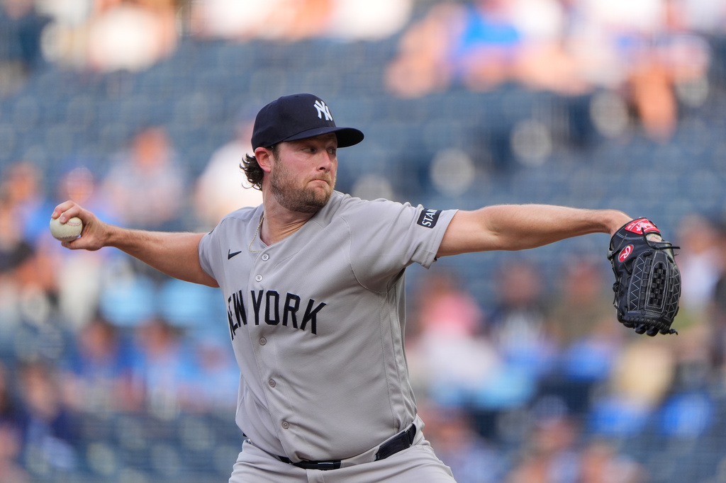 New York Yankees starting pitcher Gerrit Cole throws during the first inning of baseball game against the Kansas City Royals, Wednesday, May 27, 2026, in Kansas City, Mo. (AP Photo/Charlie Riedel)