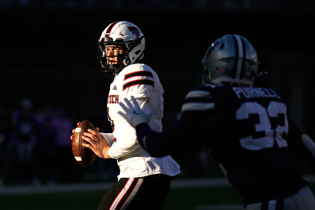 Texas Tech quarterback Behren Morton (2) looks to pass during the second half of an NCAA college football game against Kansas State, Saturday, Nov. 1, 2025, in Manhattan, Kan. (AP Photo/Charlie Riedel)