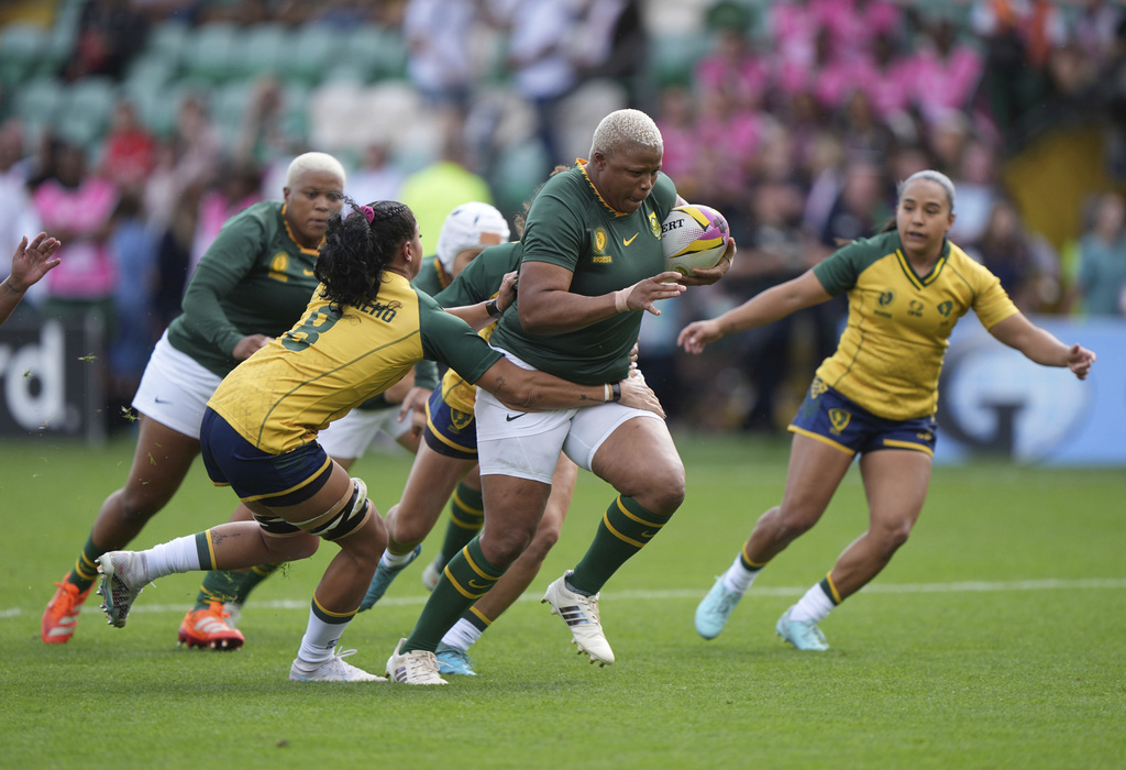 South Africa's Aseza Hele, right, is tackled by Brazil's Camilla Carvalho during the Women's Rugby World Cup 2025 Pool D match at Franklin's Gardens in Northampton, England, Sunday, Aug. 24, 2025. (Joe Giddens/PA via AP)/PA via AP)