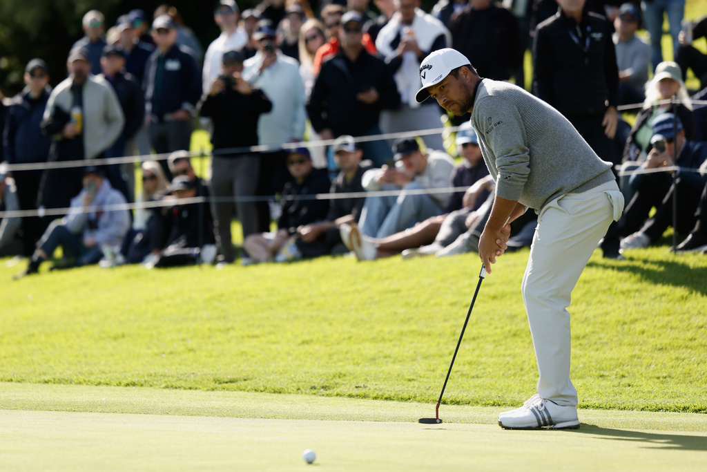 Xander Schauffele putts on the 18th hole during the second round of the Genesis Invitational golf tournament at Riviera Country Club, Friday, Feb. 20, 2026, in the Pacific Palisades area of Los Angeles. (AP Photo/Caroline Brehman)