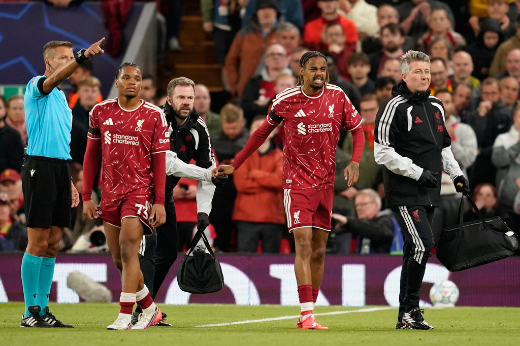 Liverpool's Bradley Barcola leaves the pitch injured during the Champions League opening phase soccer match between Liverpool and Atletico Madrid in Liverpool, England, Wednesday, Sept. 9, 2026. (AP Photo/Dave Thompson)