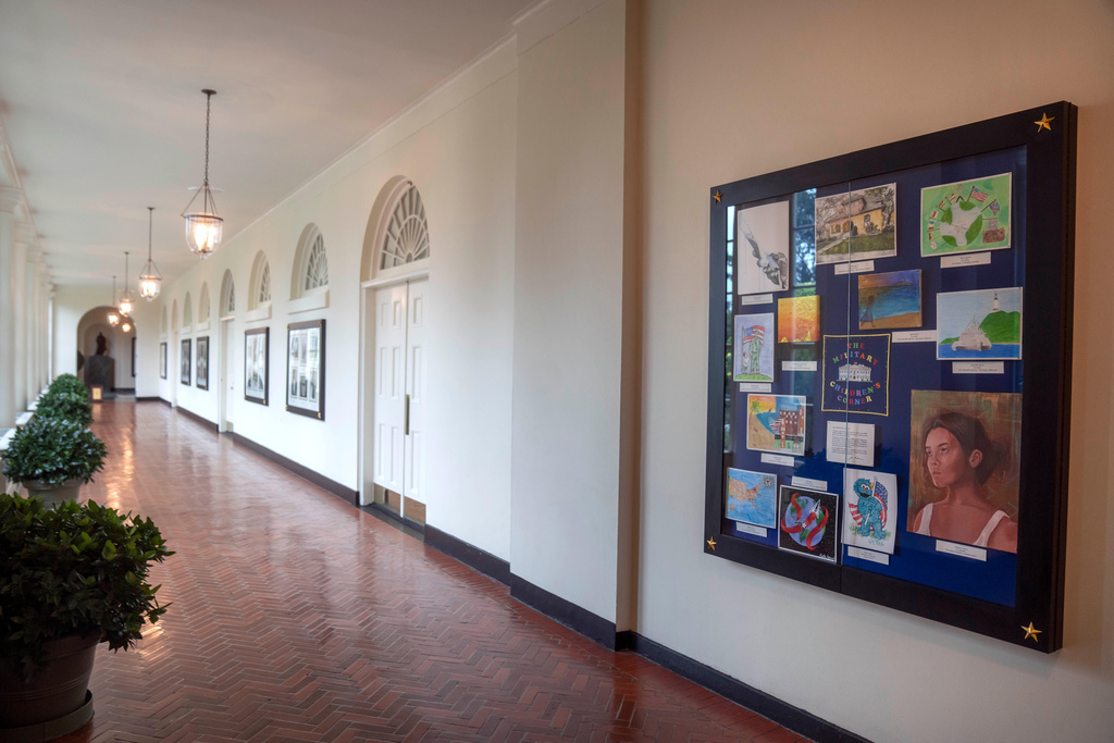 FILE - Artwork by military children decorates a display in the East Colonnade of the East Wing at the White House, Sept. 26, 2023, in Washington. (AP Photo/Mark Schiefelbein, File)