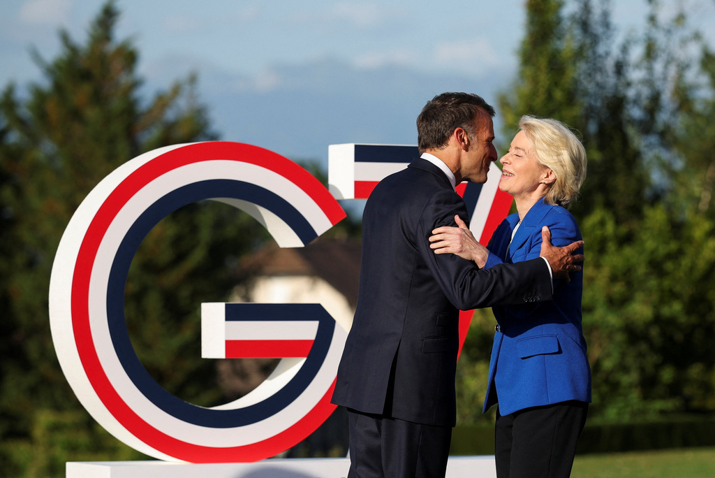 French President Emmanuel Macron, left, greets European Commission President Ursula von der Leyen during the G7 summit in Evian-les-Bains, France, Monday, June 15, 2026. (Isabel Infantes/Pool Photo via AP)