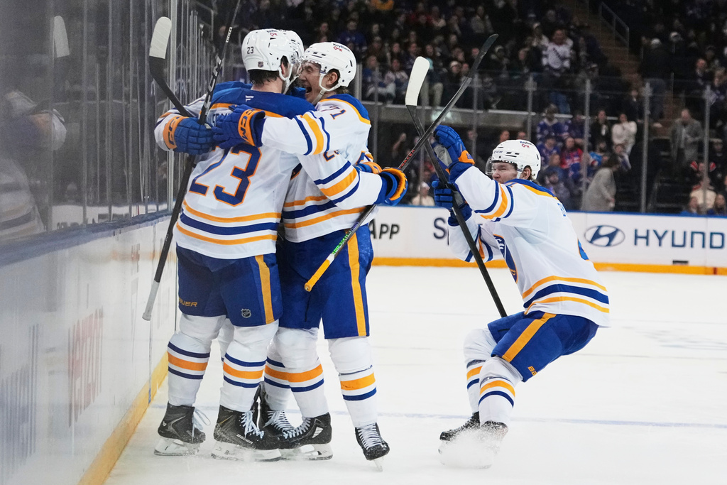 Buffalo Sabres' Mattias Samuelsson (23) celebrates with teammates after scoring a goal during the third period of an NHL hockey game against the New York Rangers Thursday, Jan. 8, 2026, in New York. (AP Photo/Frank Franklin II)