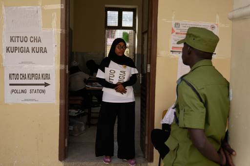 A police officer stands at the door during the counting of votes at Haile Selassie polling station in Zanzibar, Tanzania, Wednesday, Oct. 29, 2025. (AP Photo/Brian Inganga) A police officer stands at the door during the counting of votes at Haile Selassie polling station in Zanzibar, Tanzania, Wednesday, Oct. 29, 2025. (AP Photo/Brian Inganga)