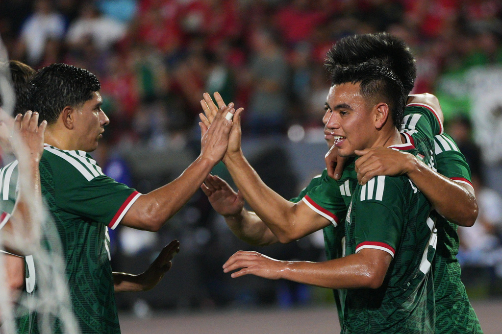 Mexican players celebrate after Panama's Richard Peralta scored an own goal, their opening goal, during an international friendly soccer match in Panama City, Thursday, Jan. 22, 2026. (AP Photo/Agustin Herrera)