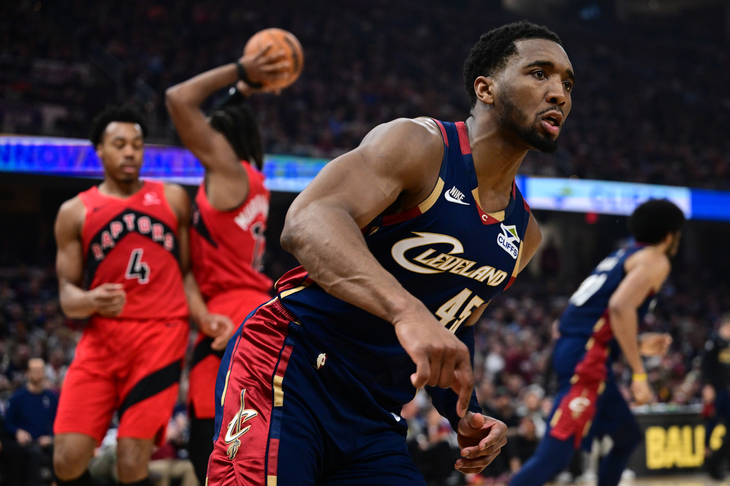 Cleveland Cavaliers guard Donovan Mitchell looks toward the referee after a basket during the second half in Game 1 of a first-round NBA playoffs basketball series against the Toronto Raptors, Saturday, April 18, 2026, In Cleveland. (AP Photo/David Dermer)
